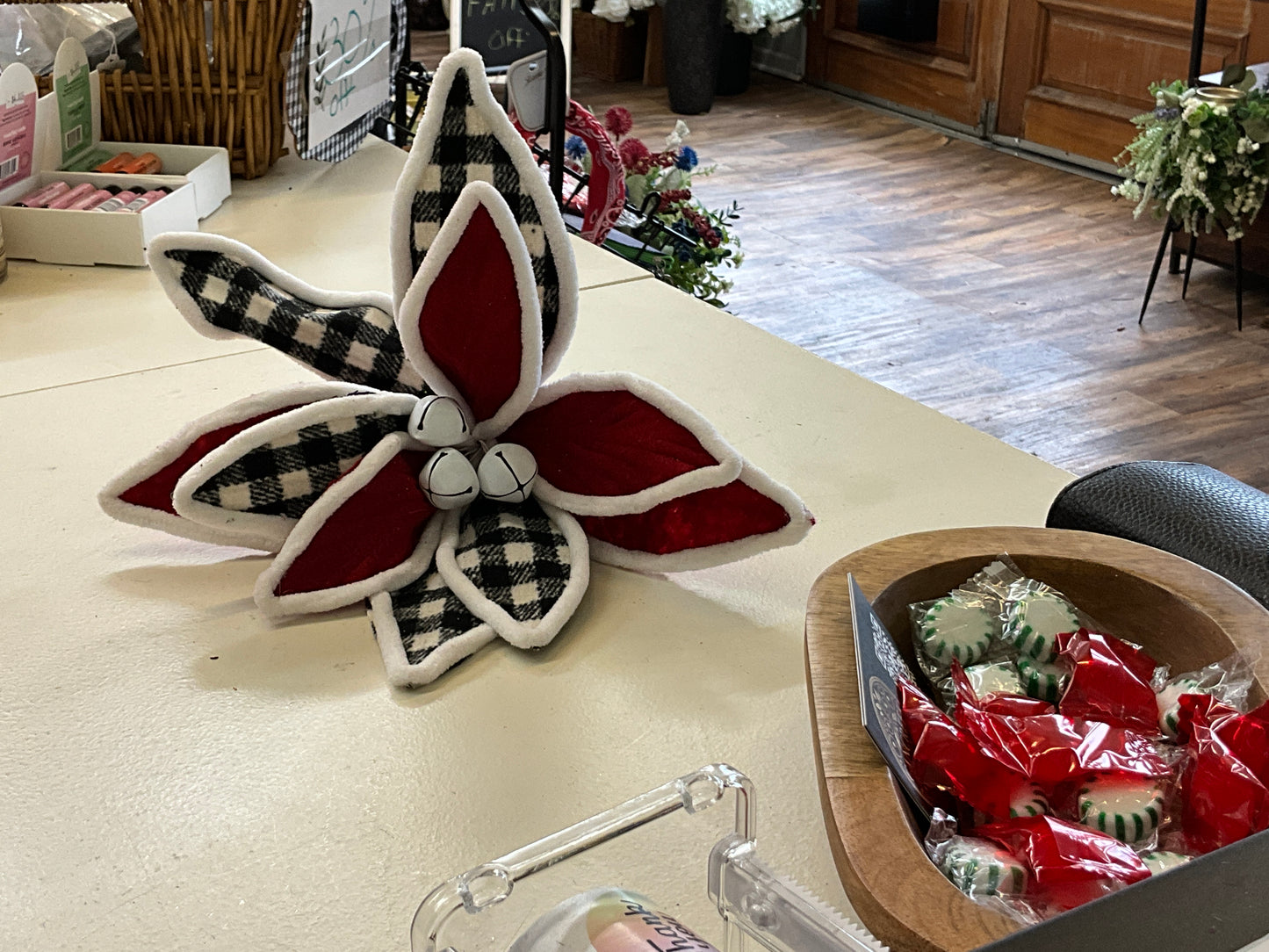 Red poinsettia w/black and white checkered w/ bells pick