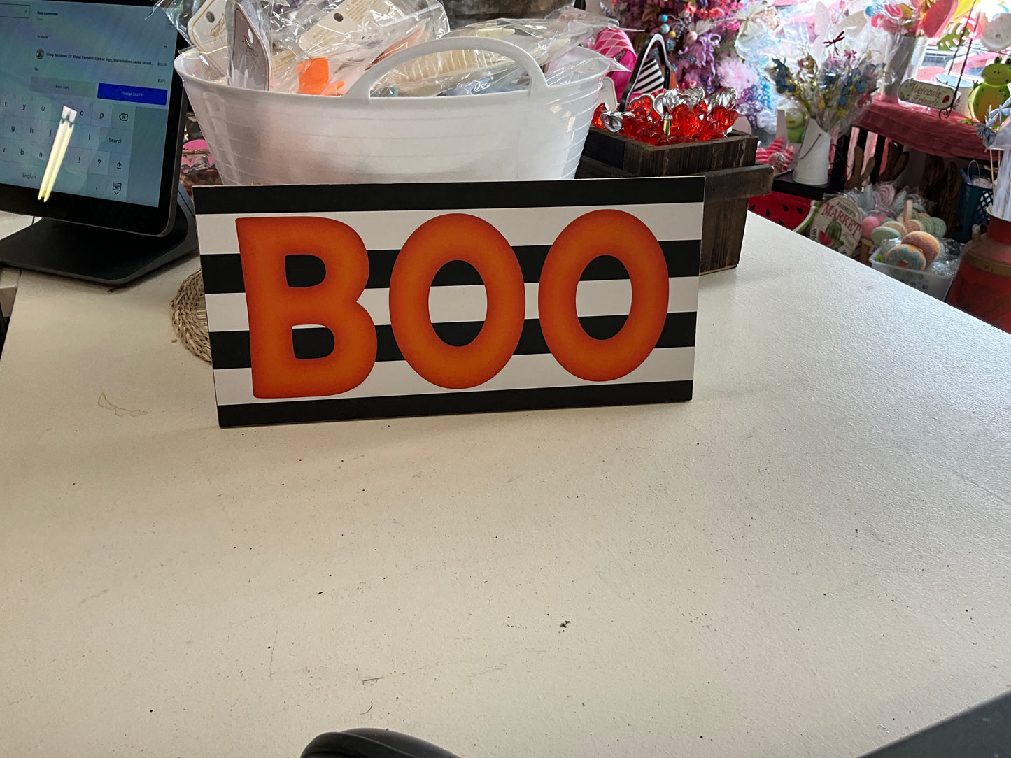 Black stripe orange blue wooden sign
