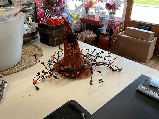 Burlap, orange hat, black, and orange vine