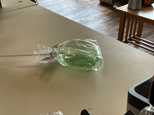 Green plastic lollipop ￼