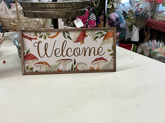Wooden mushroom welcome sign